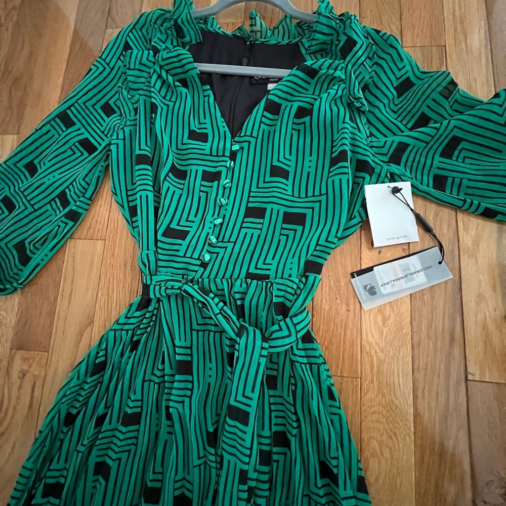 New with tags Karl Lagerfeld dress. Zip up back faux buttons on front.